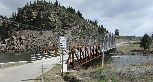 image of a steel truss bridge located approximately 3 miles west of Divide, MT