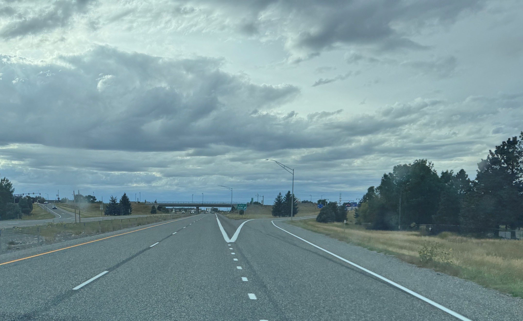 Looking west on I-90 toward the North 7th Avenue Interchange (Exit 306). This photo shows the improved road surface after chip seal and final striping were completed