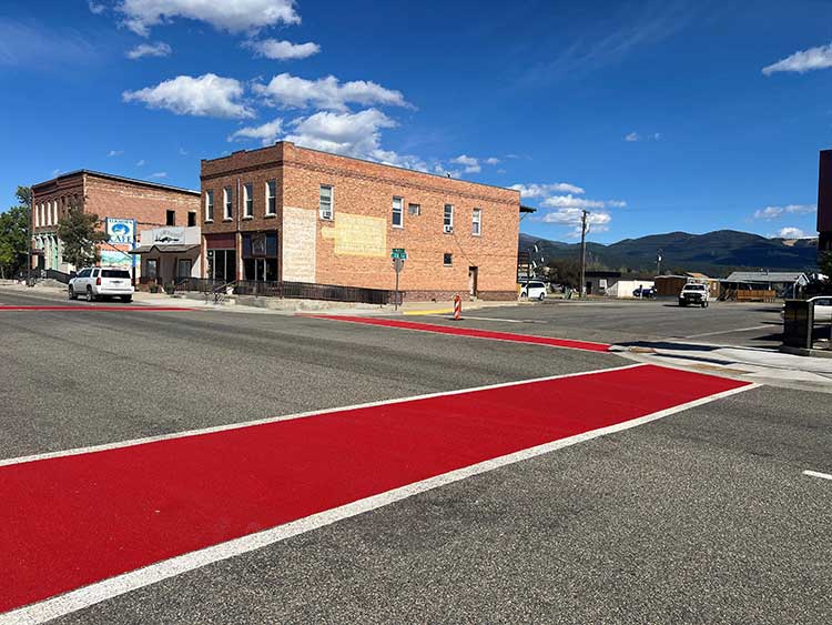 Red crosswalks in downtown.”