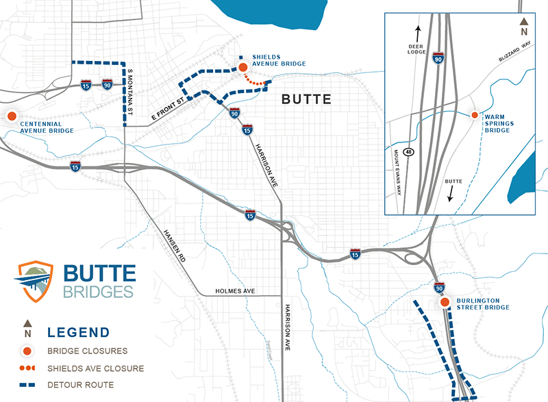 Map titled Butte Bridges. The map shows the Butte area with major routes including Interstate 90 and Interstate 15 intersecting near the center of Butte. Three bridge closure locations are highlighted: Centennial Avenue Bridge to the west, Shields Avenue Bridge near the north, and Burlington Street Bridge to the southeast near the intersection of Interstate 90 and Interstate 15. Orange dots pinpoint the bridges being closed. Dashed blue lines indicate detour routes. A dotted orange line indicates the closure area on Shields Avenue. An inset map on the right shows the Warm Springs Bridge location northwest of Butte near Interstate 90, with nearby reference points including Deer Lodge to the north and Butte to the south. A legend identifies bridge closures, the Shields Avenue closure segment, and detour routes, and a compass arrow indicates north.