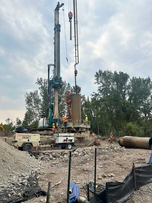 Placing the concrete for the final drilled shaft on the south side of the river.