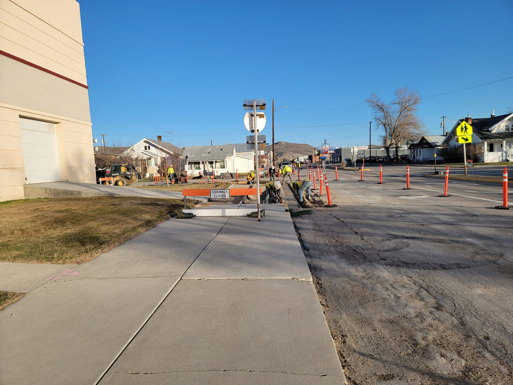 Construction workers replacing sidewalk