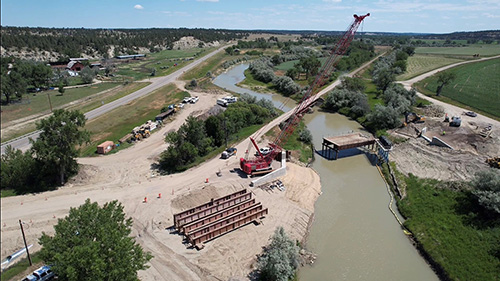 Goffena Bridge Project site showing temporary work bridge and new bridge abutments. (July 2024)