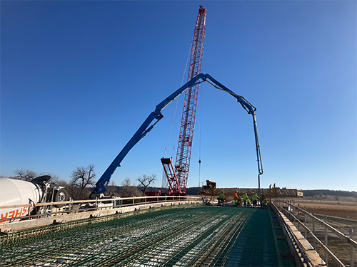 Pouring concrete for the bridge deck. (December 2024)