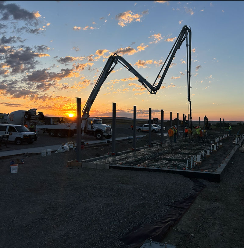 Concrete boom pump truck installing the concrete slab for the main building at the eastbound rest area site. (Dick Anderson Construction/Tyler Hansen)