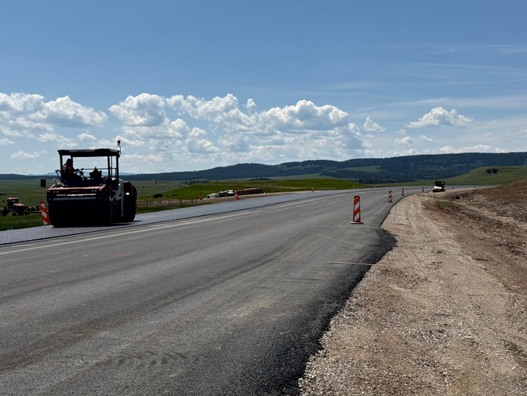 Crews paving the roadway. June 2025.