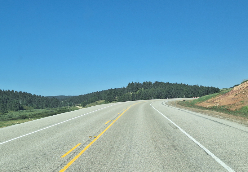 The roadway with the newly applied seal and cover (chip seal).