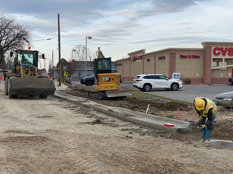  Crews installing curb and gutter on the northwest corner of the Central Avenue with 6th Street West intersection.