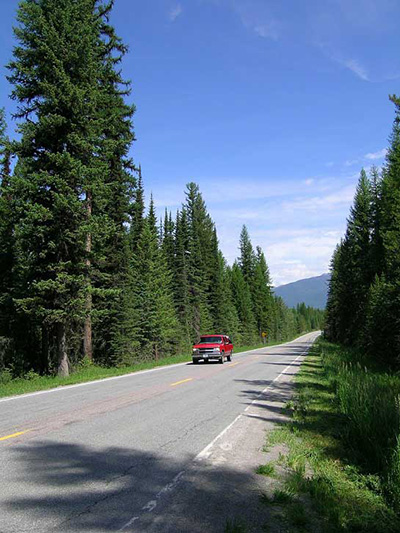 Image of a red truck on Montana Highway 83.